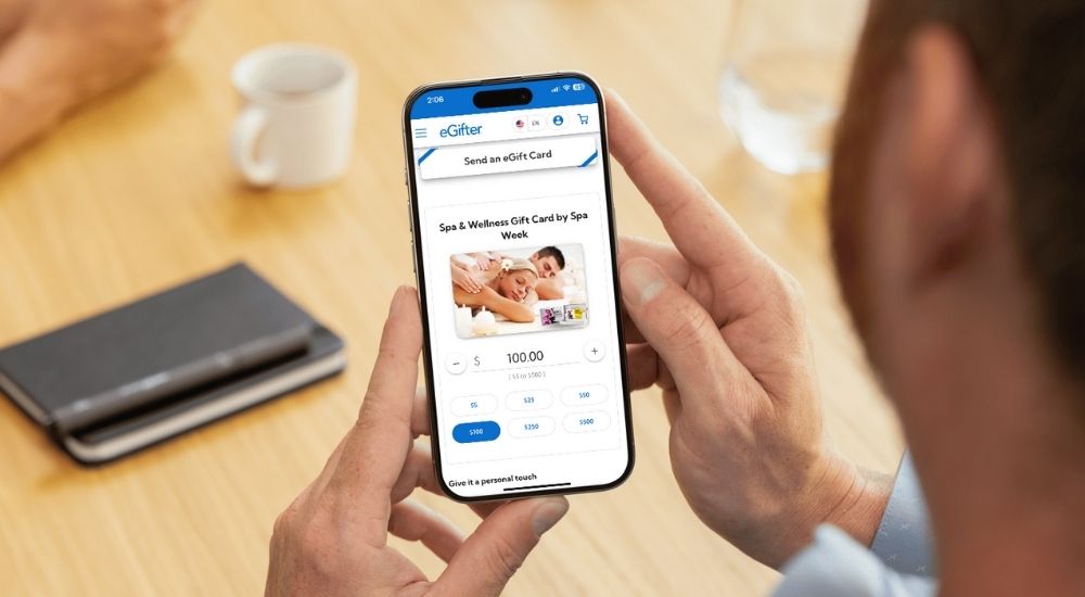 Person using eGifter app to send a Spa & Wellness Gift Card digitally from their phone