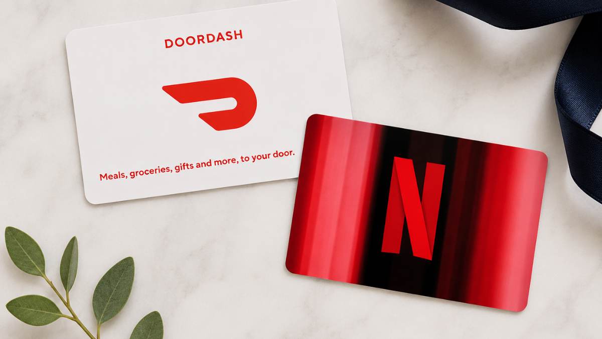 Flat lay of DoorDash and Netflix gift cards arranged together to illustrate pairing two gift cards into a complete experience, such as dinner and a movie at home.