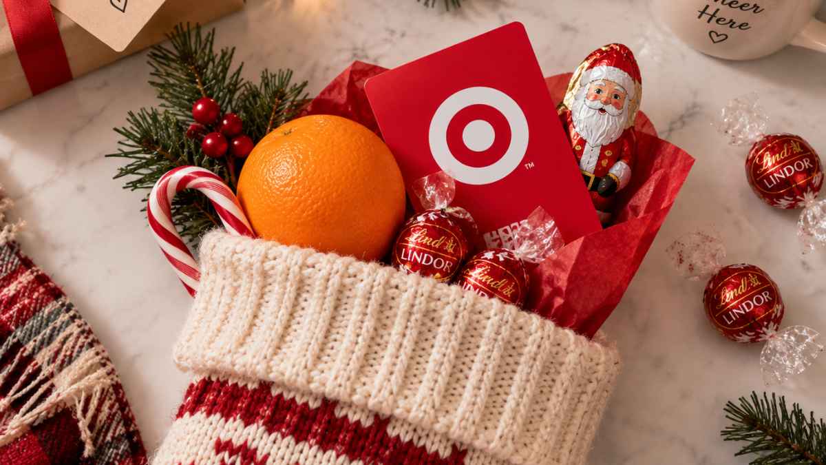 Christmas stocking filled with an orange, Target gift card, candy cane, and chocolates