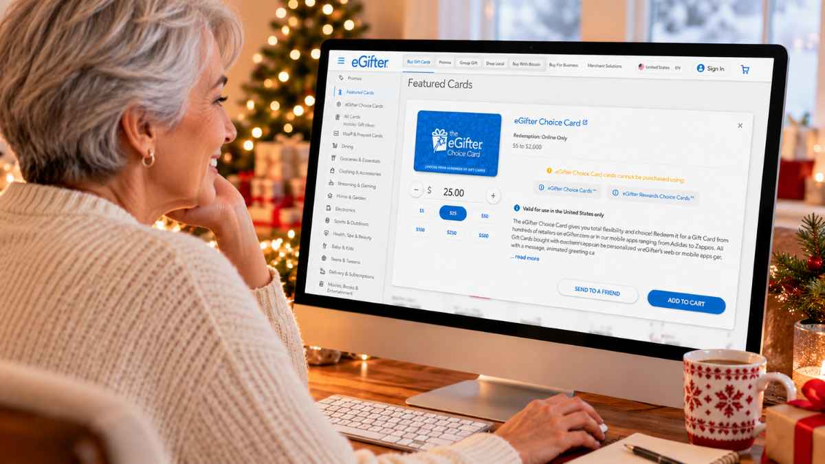 Older woman with short gray hair smiling as she shops for a last-minute Christmas gift on eGifter, selecting a $25 eGifter Choice Card on her desktop computer.